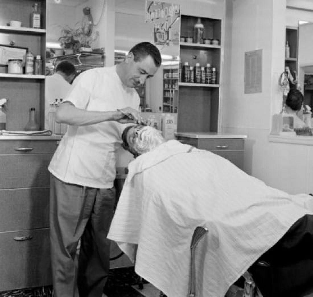 Barber shaving a mid adult man in a hair salon Canvas Art - (18 x 24)