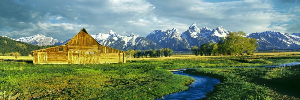 Barn in a field with mountain range in the background Moulton Barn Mormon Row Teton Range Mormon Row Historic District Grand Teton National Park Wyoming USA Canvas Art - Panoramic Images (27 x 9)