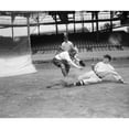 thumbnail image 1 of Baseball Game C1915. Na Runner Slides Into Home Plate While A Catcher Tries To Tag Him Out During A Baseball Game, 1 of 3