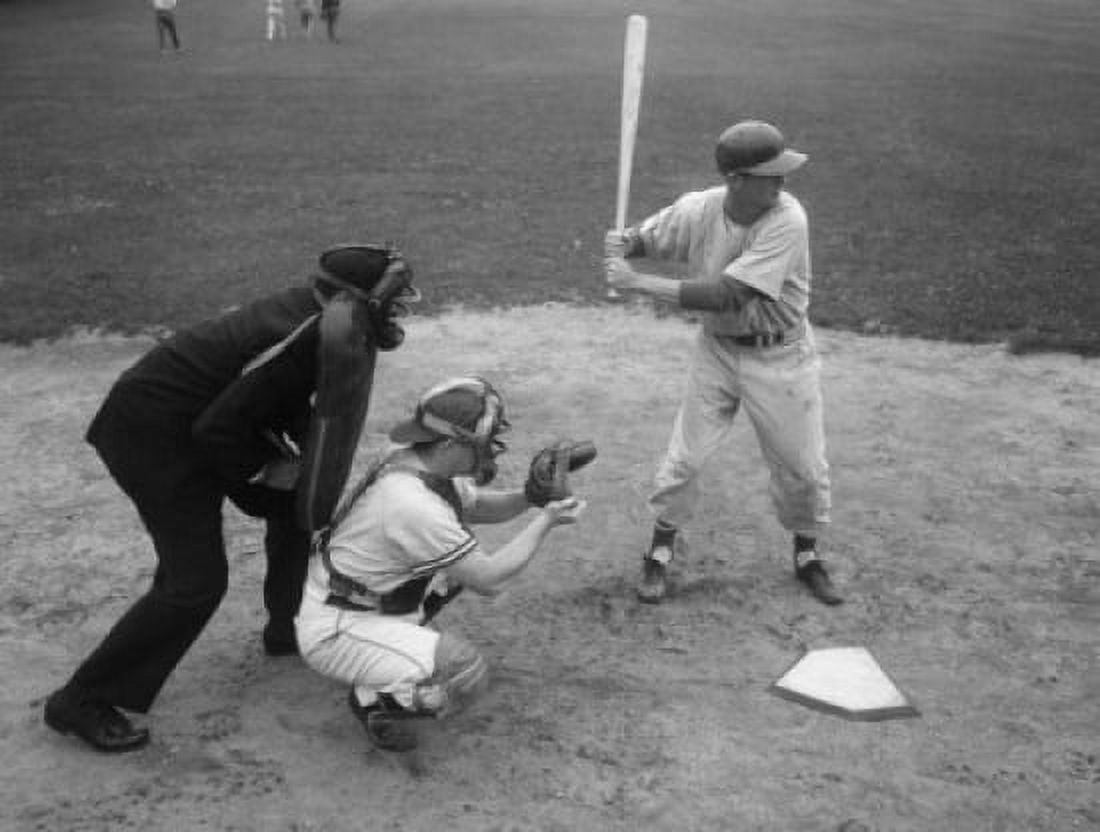 Baseball player swinging a baseball bat with a baseball catcher and a baseball umpire beside him Canvas Art - (18 x 24)