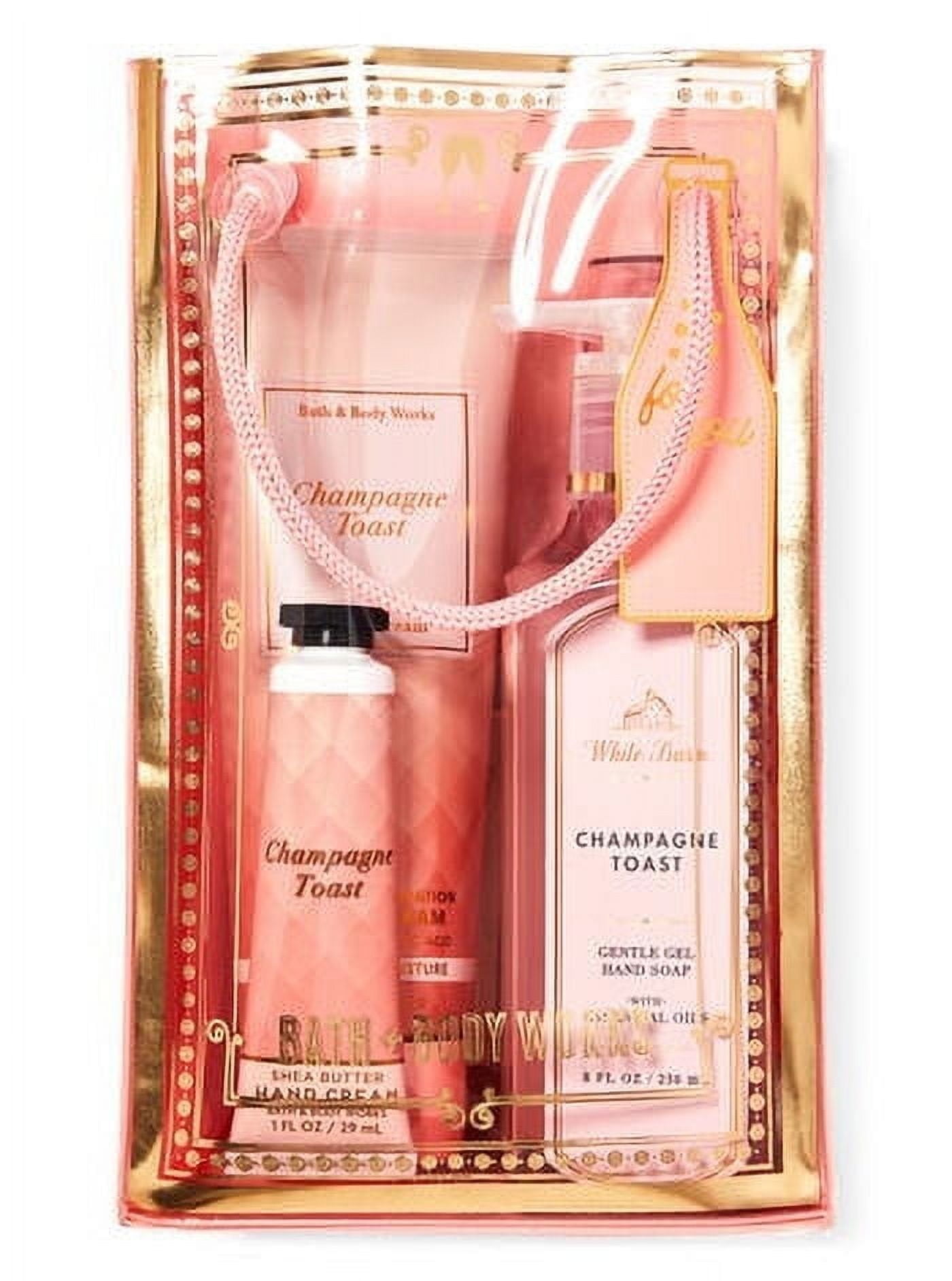 Bath and Body Works CHAMPAGNE TOAST Gift Bag Set - Ultimate Hydration Body Cream - Fine Fragrance Mist - Gentle Gel Hand Soap and Hand Cream arranged inside a transparent gift bag