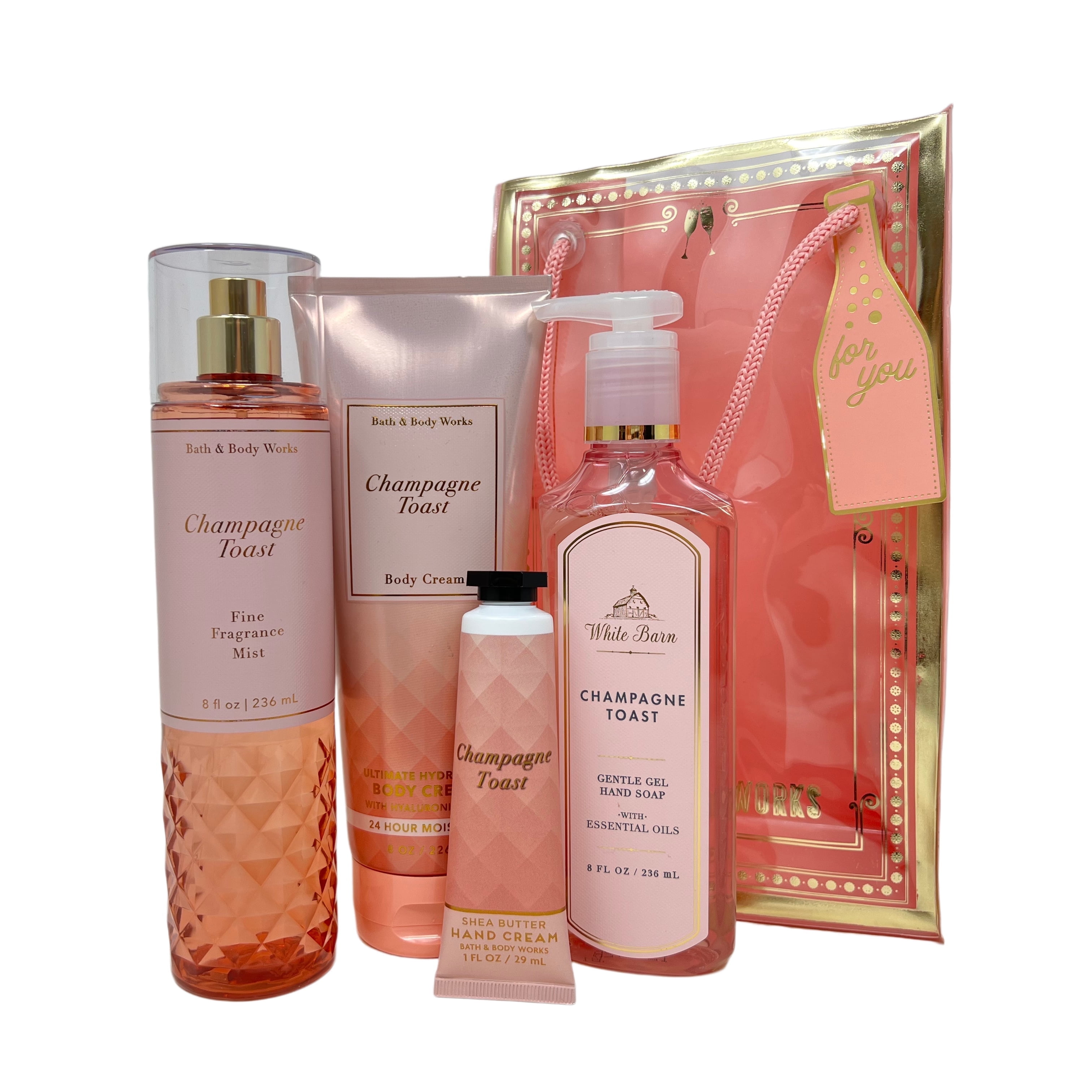 Bath and Body Works CHAMPAGNE TOAST Gift Bag Set - Ultra Shea Body Cream - Fine Fragrance Mist - Gentle Foaming Hand Soap and Hand Cream arranged inside a transparent birthday gift bag