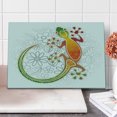 thumbnail image 1 of Batik Cutting Board, Native Southeast Common House Gecko Moon Lizard Tropical Monster Graphic Design, Decorative Tempered Glass Cutting and Serving Board, Large Size, Multicolor, by Ambesonne, 1 of 1