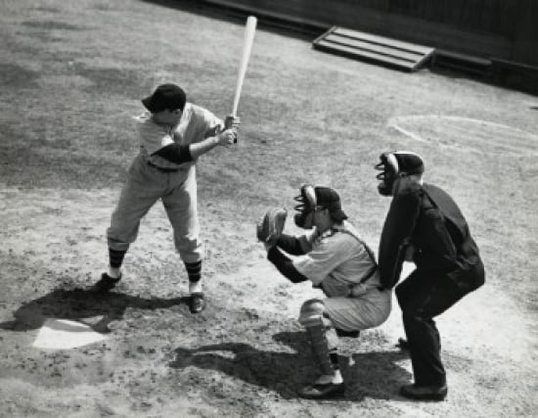 Batter swinging a bat with a catcher and an umpire crouching behind him Canvas Art - (18 x 24)