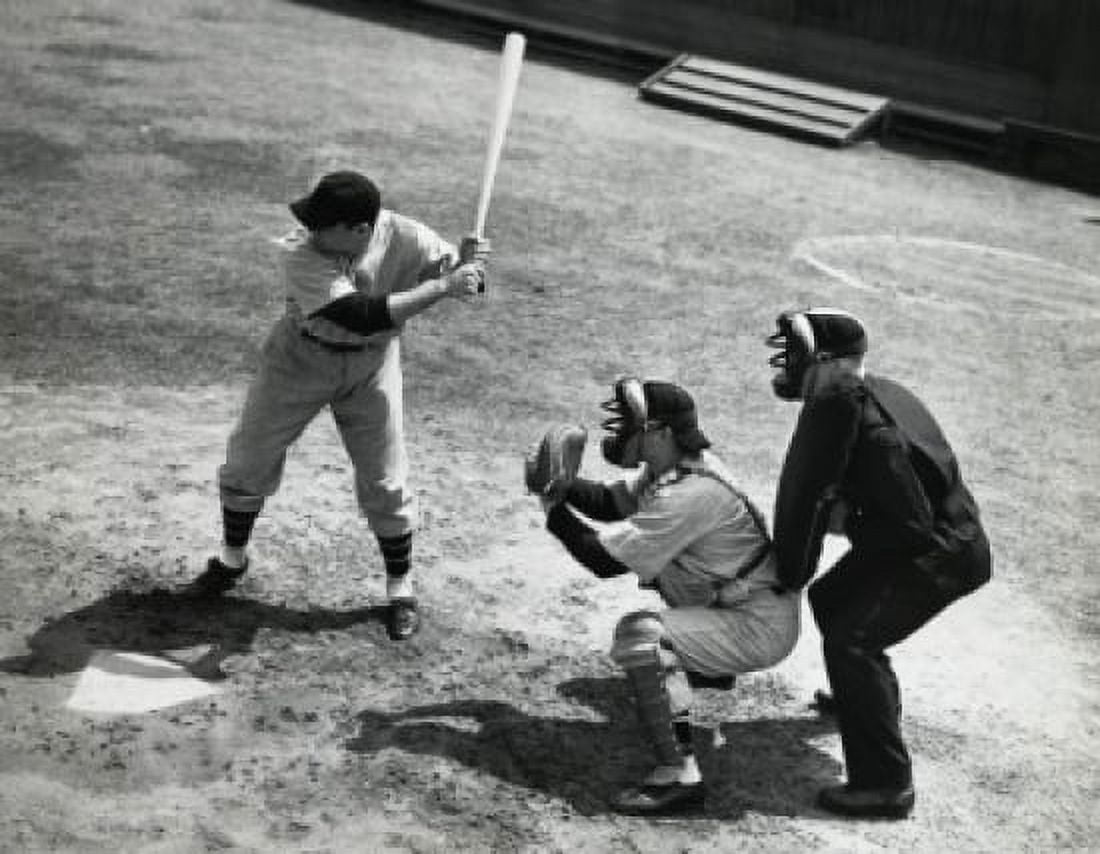 Batter swinging a bat with a catcher and an umpire crouching behind him Canvas Art - (24 x 36)