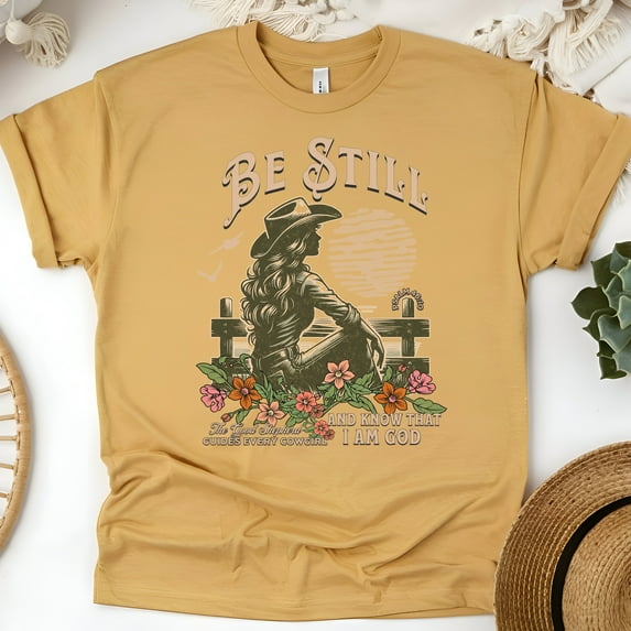 Be Still Cowgirl T-Shirt – Psalm 46:10 Faith Graphic Tee for Women, Gold, Size M