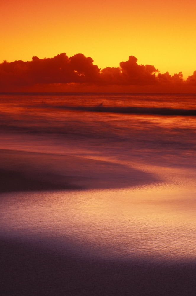 Beach At Sunset With Gentle Wave Rolling In Dark Orange Sky With Silver Reflections On Water Canvas Art - Vince Cavataio Design Pics (11 x 17)