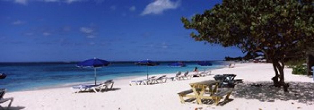 Beach chairs on the beach Shoal Bay Beach Anguilla Canvas Art - Panoramic Images (36 x 13)