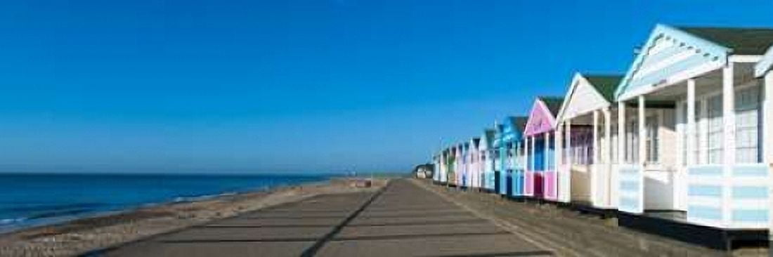 Beach huts in a row against blue skies Canvas Art - Assaf Frank (8 x 24)