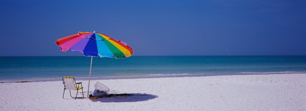 Beach umbrella and a folding chair on the beach Fort De Soto Park Tierra Verde Florida USA Canvas Art - Panoramic Images (27 x 9)