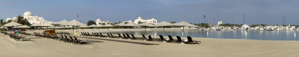Beach with government ministry at left rear Abu Dhabi United Arab Emirates Canvas Art - Panoramic Images (44 x 9)