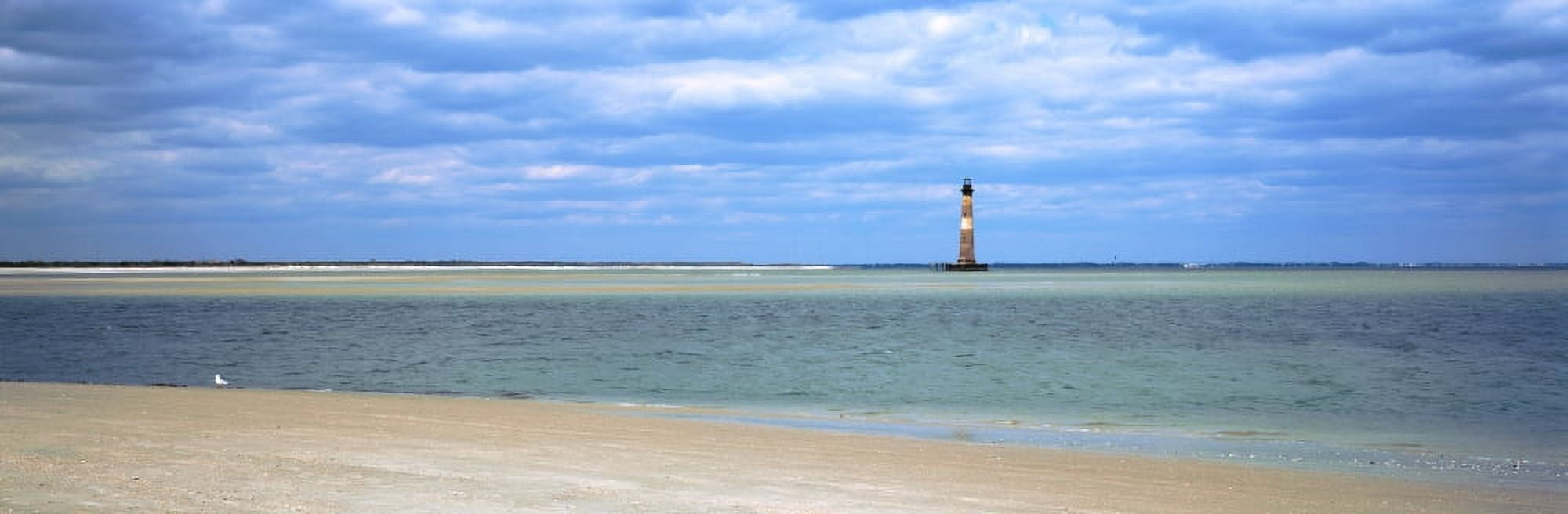 Beach with lighthouse in the background Morris Island Lighthouse Morris Island South Carolina USA Canvas Art - Panoramic Images (27 x 9)
