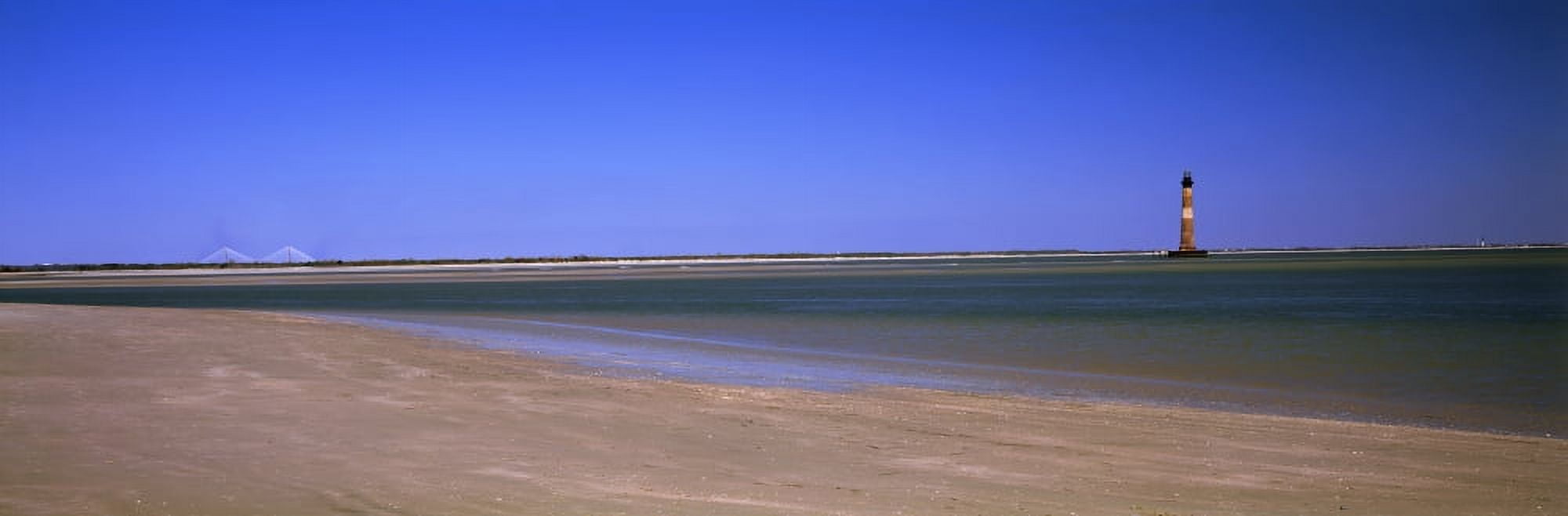 Beach with lighthouse in the background Morris Island Lighthouse Morris Island South Carolina USA Canvas Art - Panoramic Images (36 x 12)