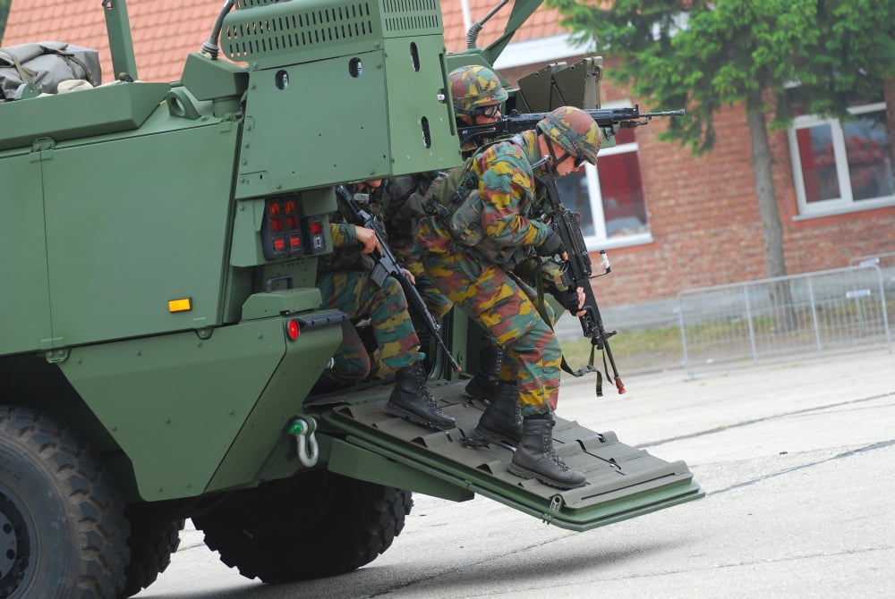 Belgian Infantry soldiers exit the Piranha IIIC armored infantry vehicle Canvas Art - Luc De JaegerStocktrek Images (17 x 12)