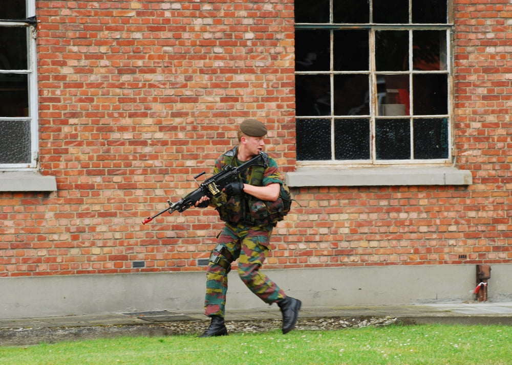 Belgian infantrists under attack around a suspect building Canvas Art - Luc De JaegerStocktrek Images (17 x 12)