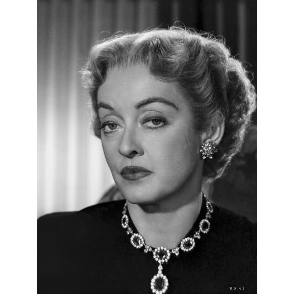 Bette Davis Portrait Looking Serious in Black Suit Dress and Black Gem Necklace with Middle parted Curls Photo Print (8 x 10)
