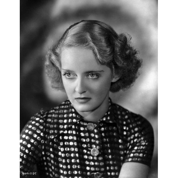 Bette Davis Portrait Looking Serious with Waved Hairstyle in White Polka Dot Short Sleeved Shirt Photo Print (24 x 30)