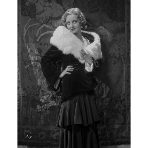 Bette Davis Posed Hand on the Waist in White Fur Boa in Black Long Sleeve Dress and Ruffled Skirt Photo Print (8 x 10)
