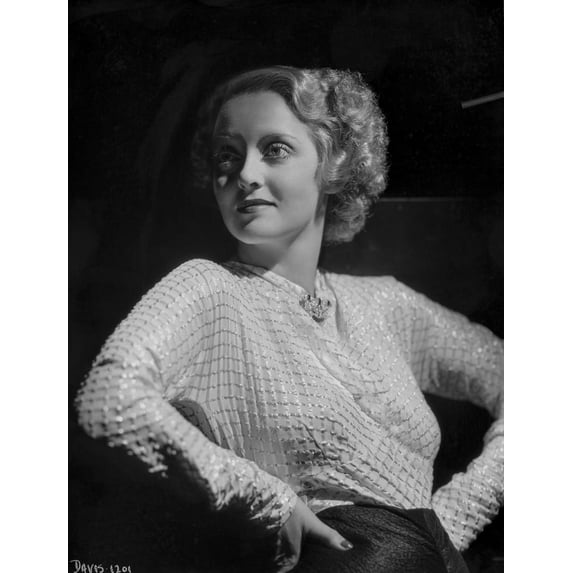 Bette Davis Posed Hands on the Waist and Looking to the Right in Glossy Long Sleeve High Neck Dress and Black Skirt Photo Print (24 x 30)