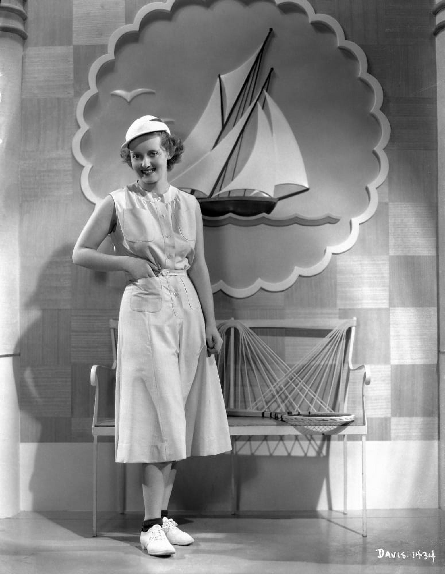 Bette Davis Posed With Hands On The Pocket In White Sleeveless Dress bette-davis-posed-with-hands-on-the-pocket-in-white-sleeveless-dress
