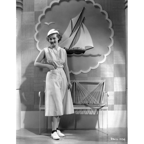 Bette Davis Posed with Hands on the Pocket in White Sleeveless Dress and White Round Cap with White Shoes Photo Print (24 x 30)