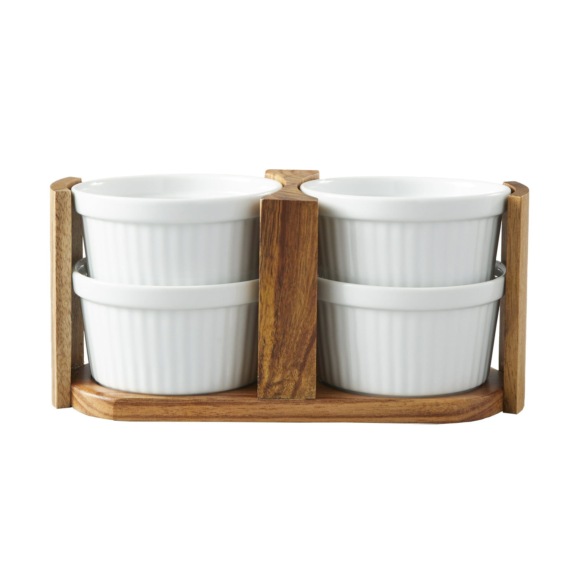 A brown wooden holder with four white ramekins in it