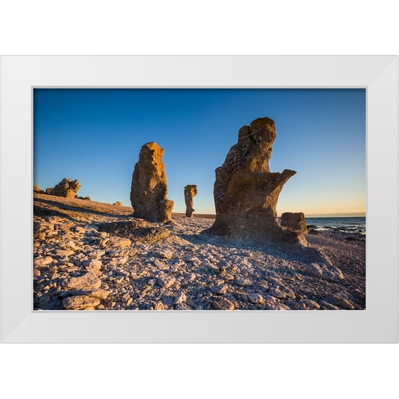 Bibikow, Walter 14x11 White Modern Wood Framed Museum Art Print Titled - Sweden-Faro Island-Langhammars Area-Langhammar coastal limestone rauk rock-sunset