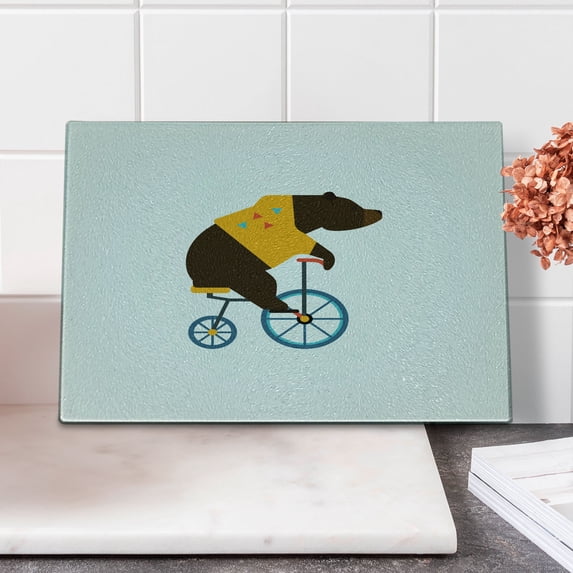 Bicycle Cutting Board, Big Teddy Bear of Circus Riding Bicycle with Hipster Costume Animal Image, Decorative Tempered Glass Cutting and Serving Board, Small Size, Brown Yellow, by Ambesonne