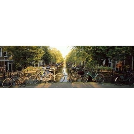 Bicycles On Bridge Over Canal Amsterdam Netherlands Poster Print, 36 x 12