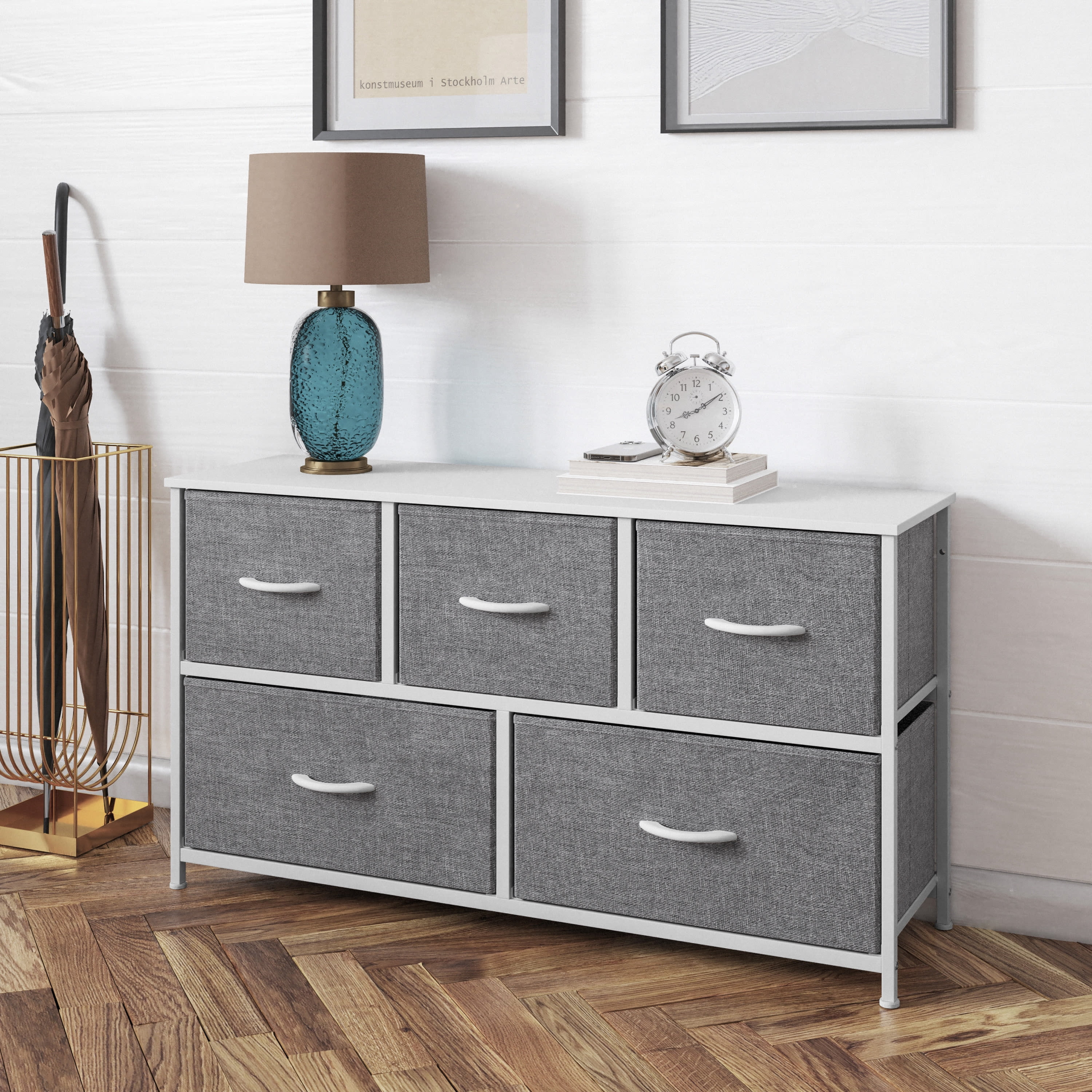 gray dresser with silver pulls Loving the color combo on this piece. Painted in a cool, icy gray the silver hardware compliments the paint color perfectly. Every single drawer on this dresser opens, making it an 8