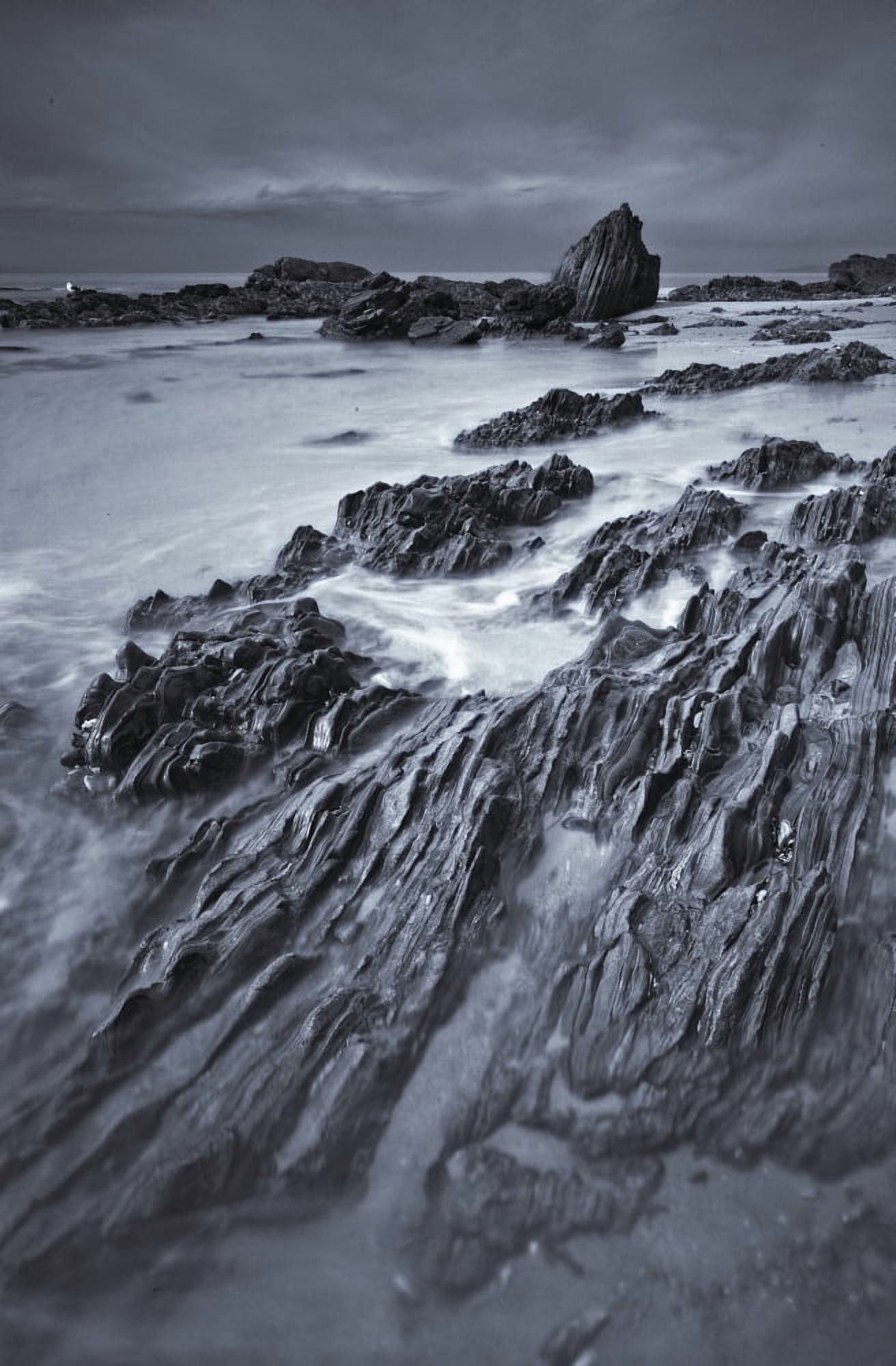 Black And White Of Rock Formations At Moro Beach California Canvas Art - Robert Postma Design Pics (11 x 17)