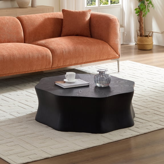 Black petal coffee table, with fiberglass surface covered with birch wood grain veneer in watercolor finish and sprayed with black paint