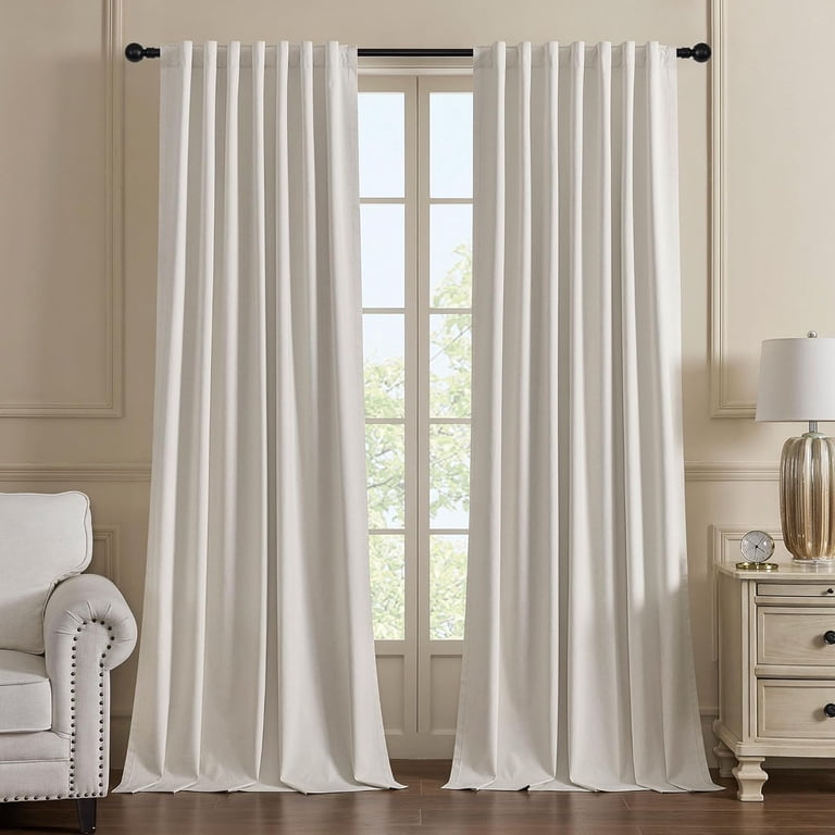 floor-to-ceiling blackout curtains with decorative rod in living room