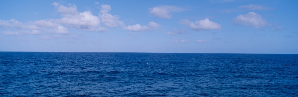 Blue Pacific ocean and clouds off Hawaii Canvas Art - Panoramic Images (36 x 12)