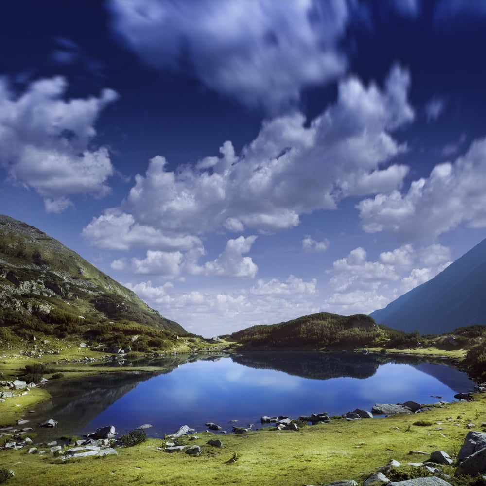 Blue lake in the Pirin Mountains over tranquil clouds Pirin National Park Bulgaria Canvas Art - Evgeny KuklevStocktrek Images (29 x 29)