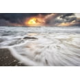 thumbnail image 1 of Blur of the tide washing up on the sandy shore along the coast and a golden sun peaking through storm clouds; Nordland, Norway by Marg Wood / Design Pics (19 x 12), 1 of 3