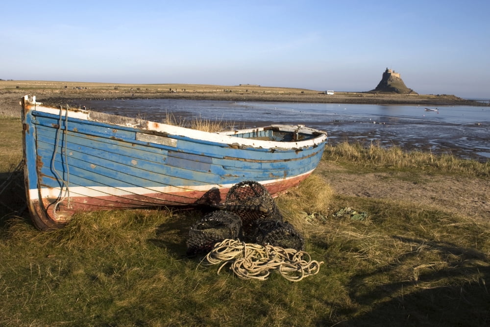 Boat On Shore Near Holy Island England Canvas Art - John Short Design Pics (17 x 11)