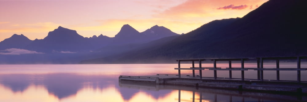 Boat dock at Lake McDonald Glacier National Park Montana Canvas Art - Panoramic Images (27 x 9)