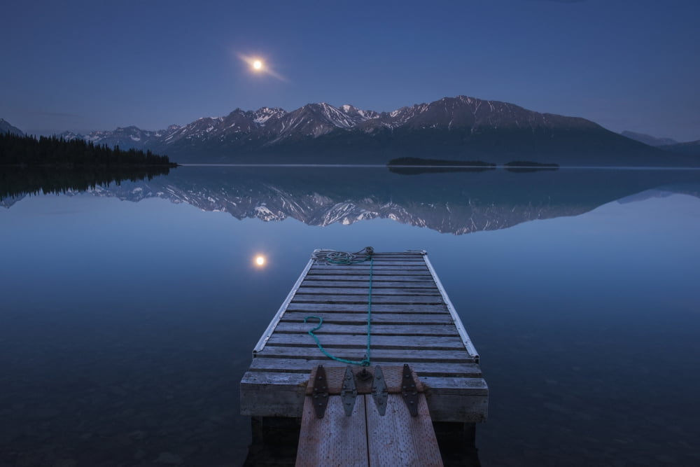 Boat dock with a full moon rising over the Chigmit Mountains at Lake Clark in Lake Clark National Park and Preserve Alaska Canvas Art - Carl Johnson Design Pics (19 x 12)