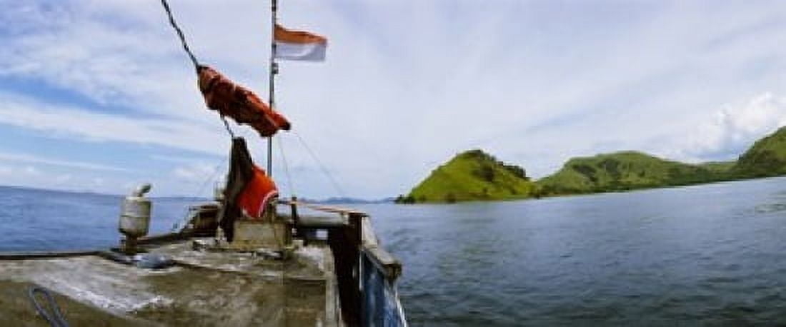 Boat in the sea with islands in the background Flores Island Indonesia Canvas Art - Panoramic Images (30 x 13)