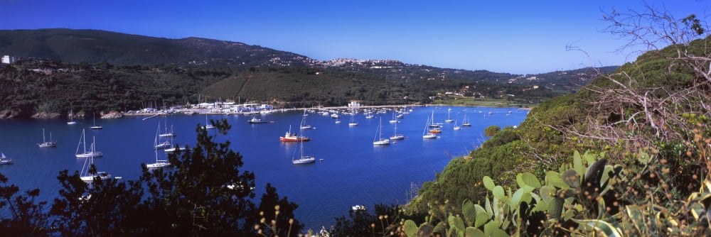 Boats at a harbor Porto Azzurro Island of Elba Tuscany Italy Canvas Art - Panoramic Images (27 x 9)