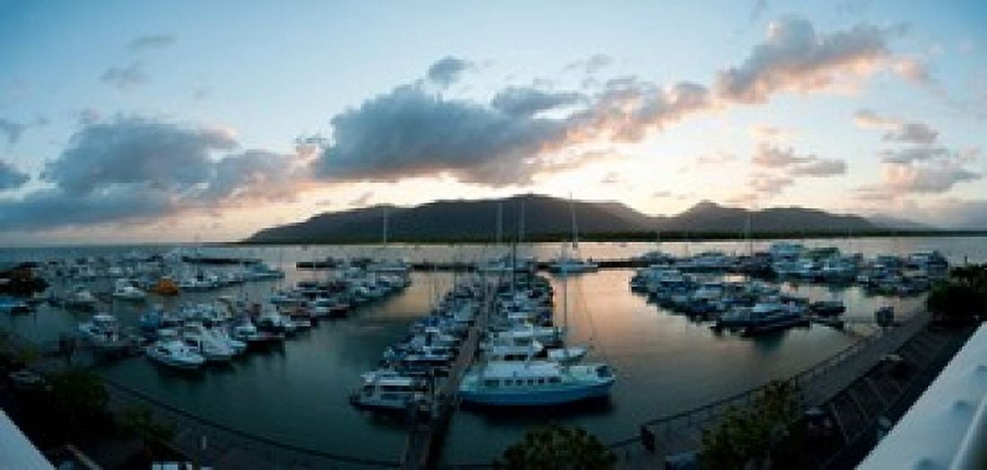 Boats at a marina at dusk Shangri-La Hotel Cairns Queensland Australia Canvas Art - Panoramic Images (24 x 12)