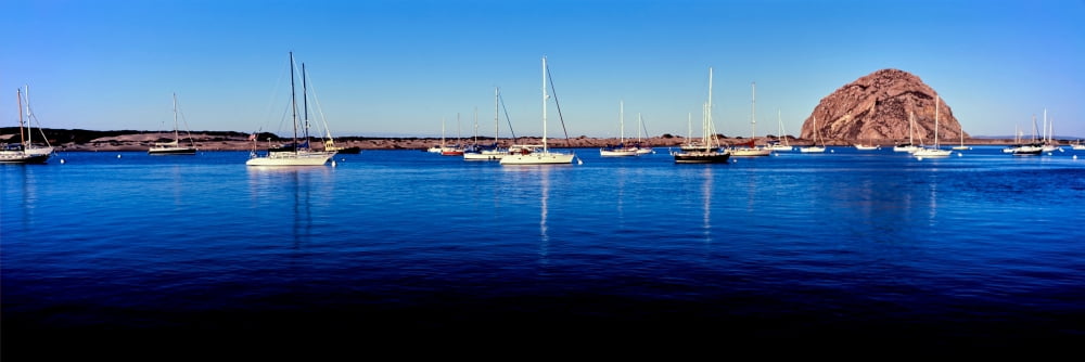 Boats at harbor in front of the Morro Rock Morro Bay San Luis Obispo County California USA Canvas Art - Panoramic Images (12 x 36)