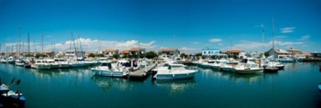Boats docked in the small harbor Saintes-Maries-De-La-Mer Bouches-Du-Rhone Provence-Alpes-Cote dAzur France Canvas Art - Panoramic Images (18 x 6)