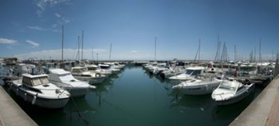 Boats docked in the small harbor Saintes-Maries-De-La-Mer Bouches-Du-Rhone Provence-Alpes-Cote dAzur France Canvas Art - Panoramic Images (30 x 14)