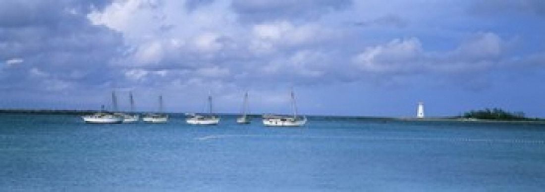 Boats in the sea with a lighthouse in the background Nassau Harbour Lighthouse Nassau Bahamas Canvas Art - Panoramic Images (18 x 7)