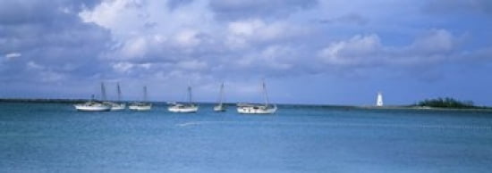 Boats in the sea with a lighthouse in the background Nassau Harbour Lighthouse Nassau Bahamas Canvas Art - Panoramic Images (36 x 13)