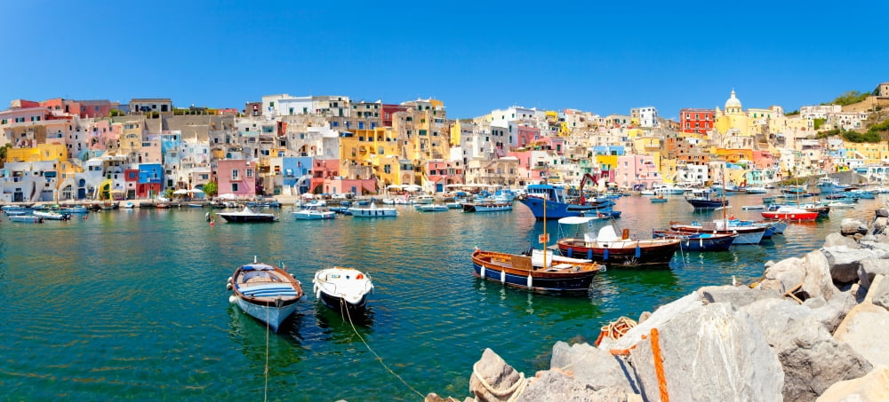 Boats moored at a port Marina Corricella Procida Bay of Naples Campania Italy Canvas Art - Panoramic Images (36 x 12)
