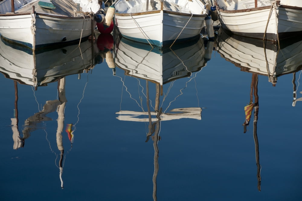 Boats mooring in a harbour with the mirror image in the tranquil water Majorca Spain Canvas Art - Ian Cumming Design Pics (19 x 12)