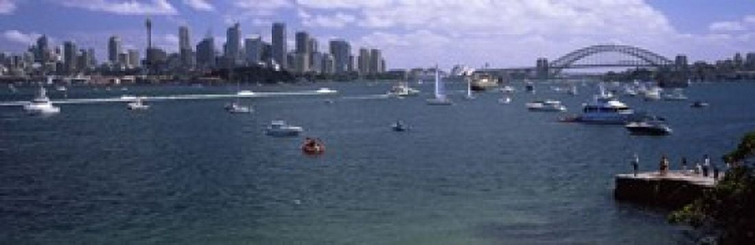 Boats in the sea with a bridge in the background Sydney Harbor Bridge Sydney Harbor Sydney New South Wales Australia Canvas Art - Panoramic Images (18 x 6)